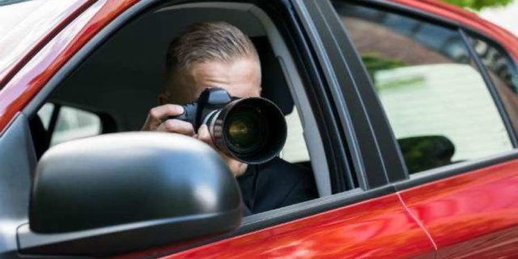 a red car with a private investigator